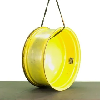 USED 16 X 38 10-13.187-11.07-12.4 OUTSIDE DOLLY DUAL YELLOW WHEEL
