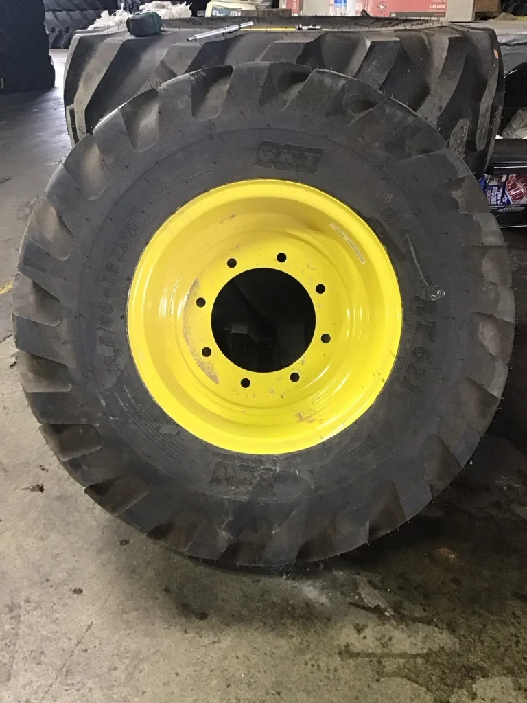 Take-Off 12.5/80-18 BKT AT621 TL R-4 95-100% on 9 X 18 8-10.82-8.78 GKN Solid Yellow Wheel(Assembly)