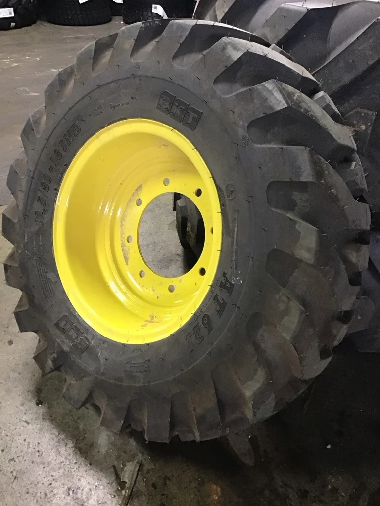 Take-Off 12.5/80-18 BKT AT621 TL R-4 95-100% on 9 X 18 8-10.82-8.78 GKN Solid Yellow Wheel(Assembly) image 2