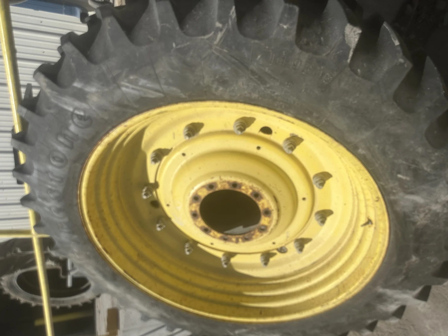 Used 40% 420/85R34 Firestone Radial All Traction Deep Tread R-1W (147B) TL on a 15 x 34 JD Yel