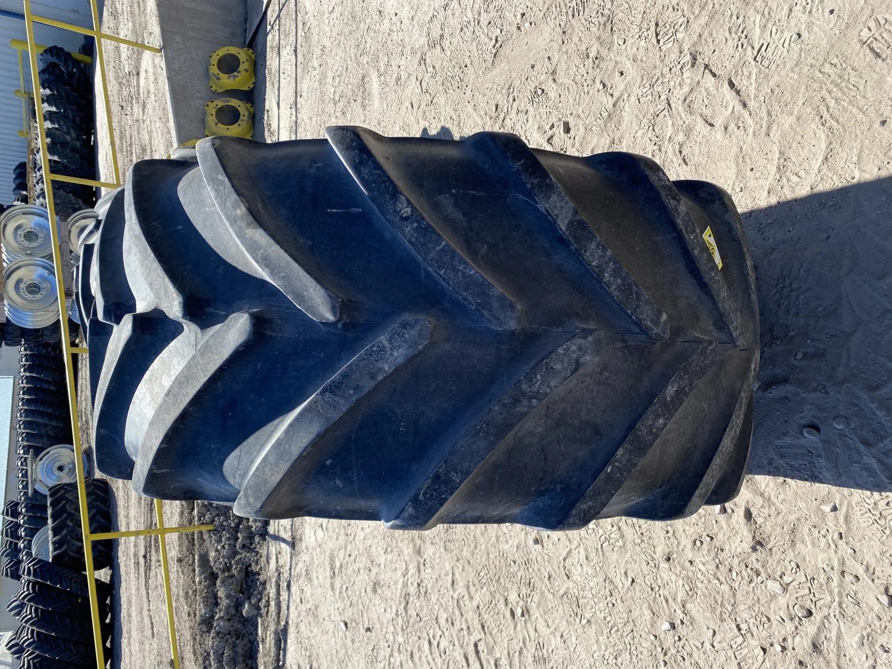 Used 600/65R28 Michelin XM28 TL 67% on a 18 x 28 JD Yellow Waffle Wheel (3 Bolt) 4" offset   ( image 4