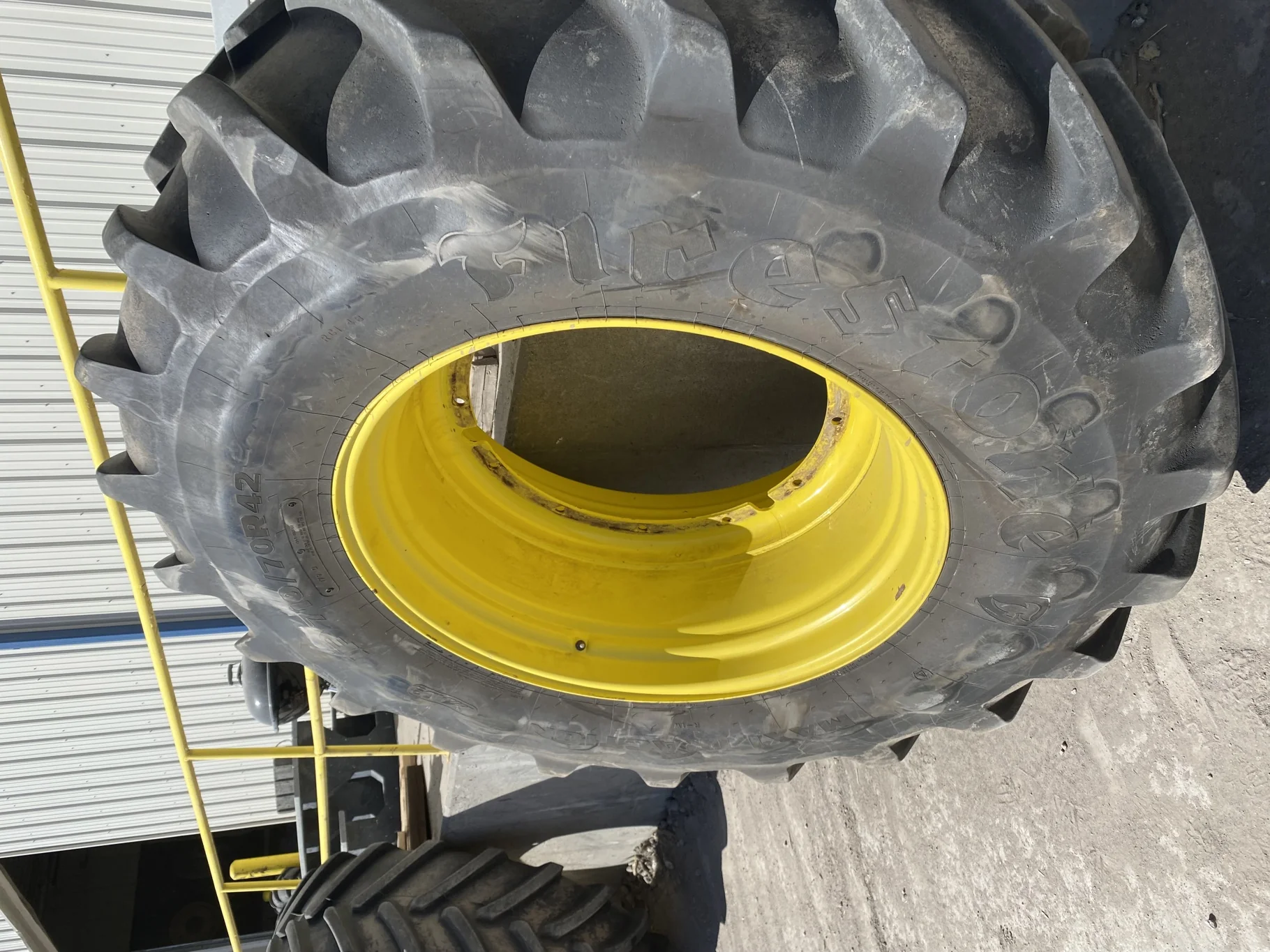 Used 93% IF710/70R42 Firestone Maxi Traction R-1W (179D) TL on a 23 x 42 JD Yellow 12-32.04-30.07 image 3