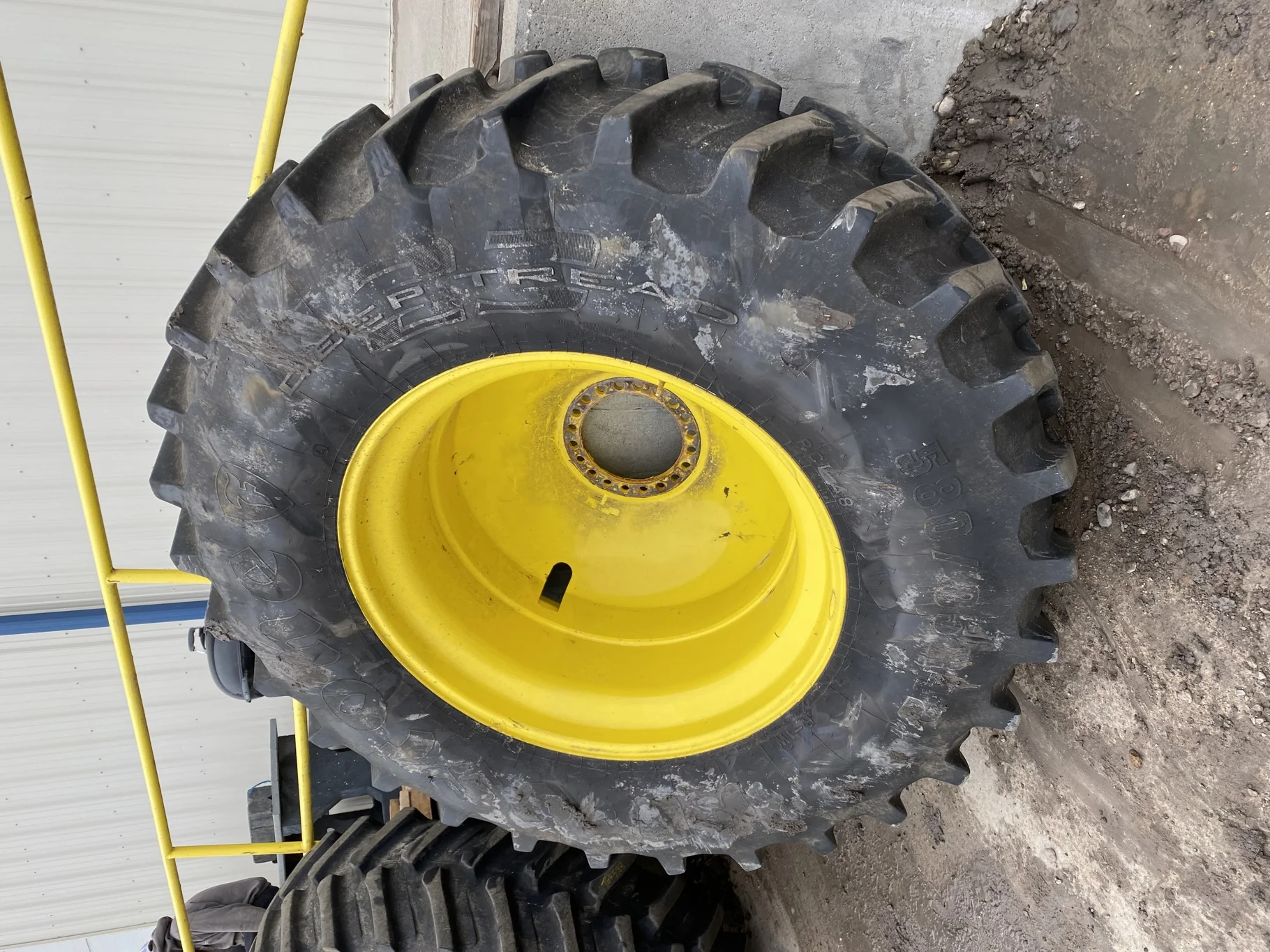 Used 580/85R42 Firestone Radial Deep Tread 23 R-1W (166B) TL 85% on a 18 x 42 JD Yellow 20 B Inside