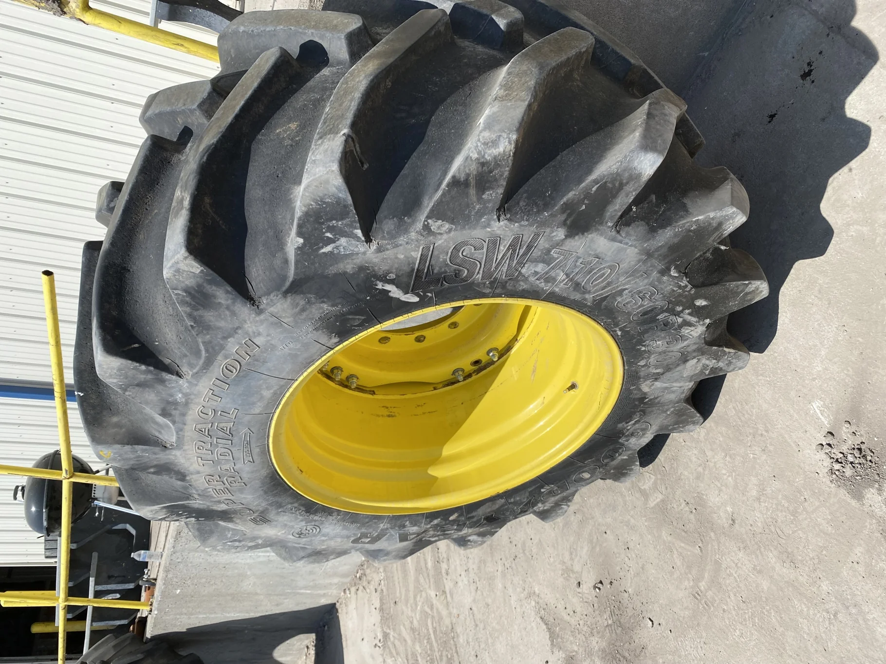 Used LSW 710/60R30 Goodyear Super Traction Radial (177D) 85% mounted on 25 x 30 JD Yellow 12 B