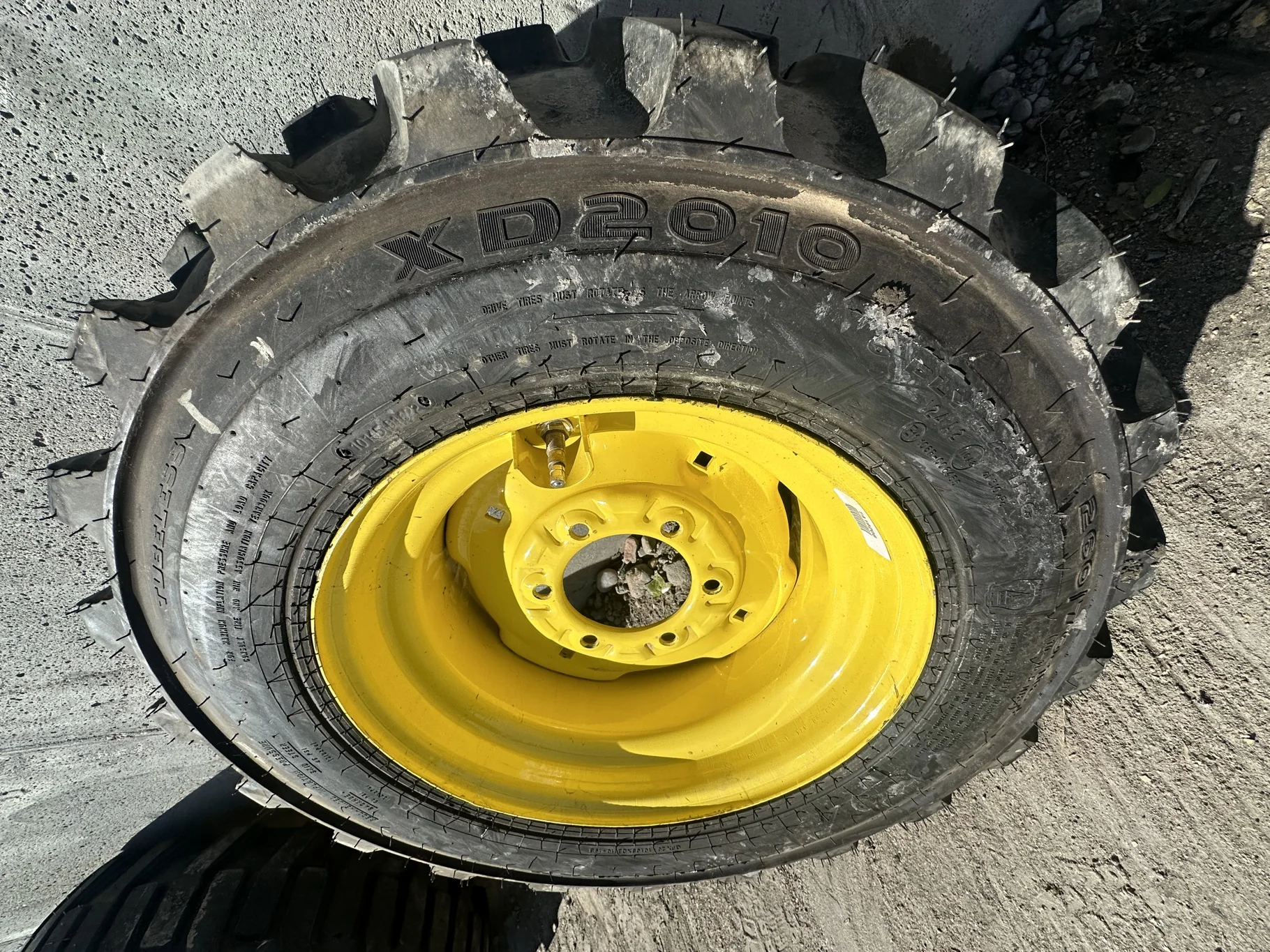 Take-Off 10-16.5 NHS Galaxy XD2010 (6Ply) TL on a 8.25 X 16.5 JD Yellow 6 Bolt Implement Wheel