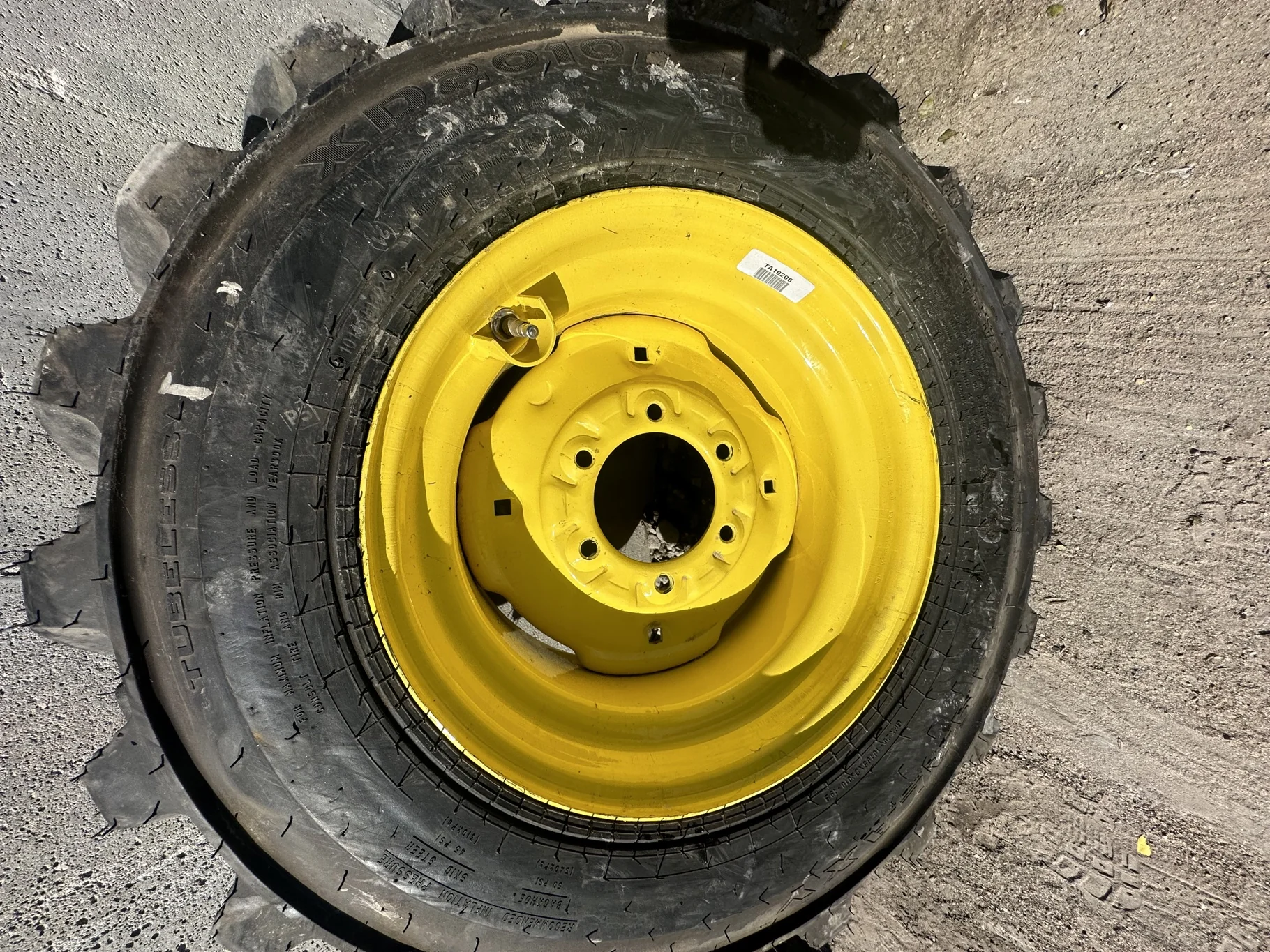 Take-Off 10-16.5 NHS Galaxy XD2010 (6Ply) TL on a 8.25 X 16.5 JD Yellow 6 Bolt Implement Wheel image 2