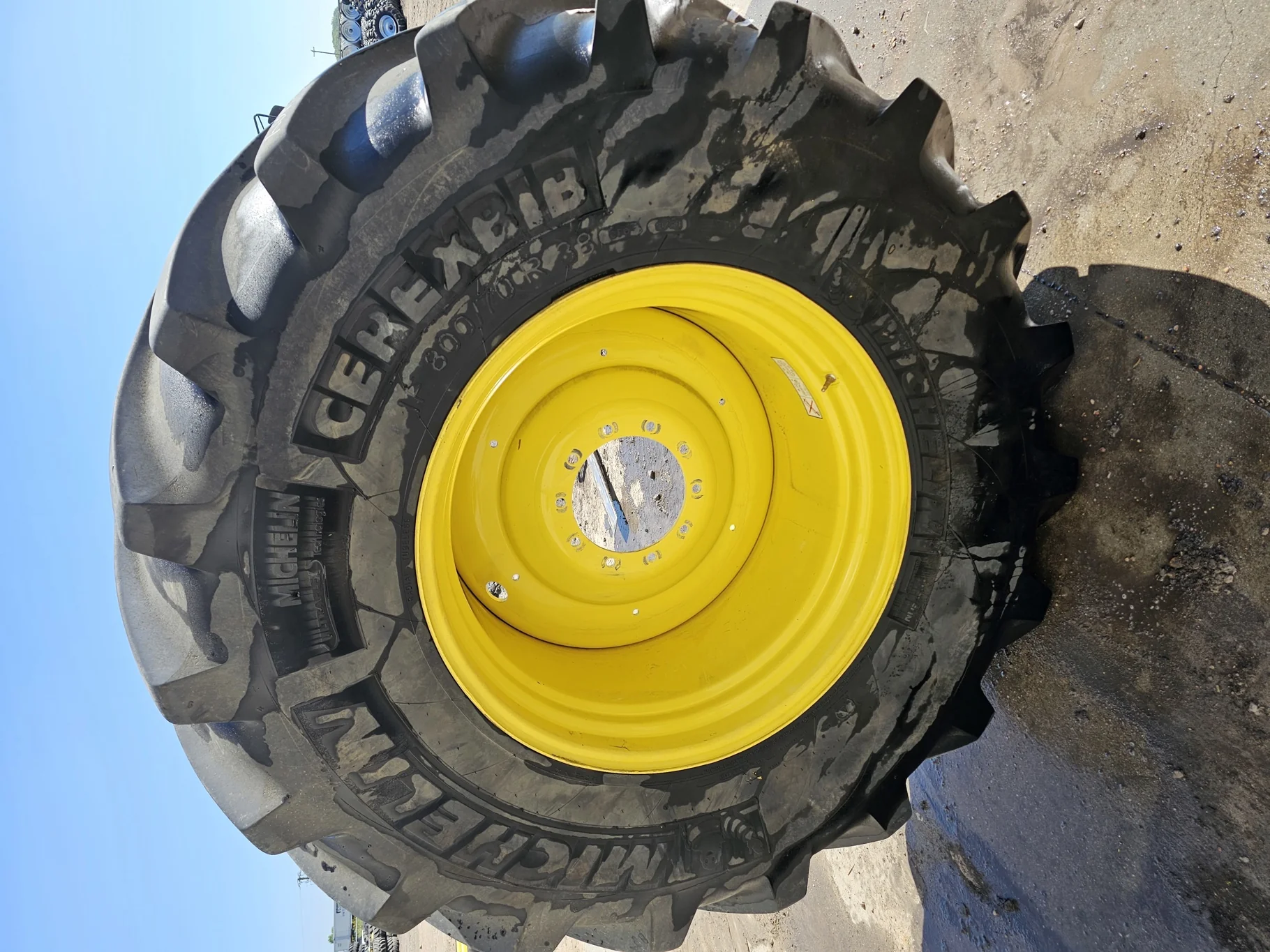 Used 90% IF800/70R38 CFO+ Michelin CerexBib 2 R-1W 187A8 TL on a 27 x 38 JD Yellow 10 Bolt Combine W