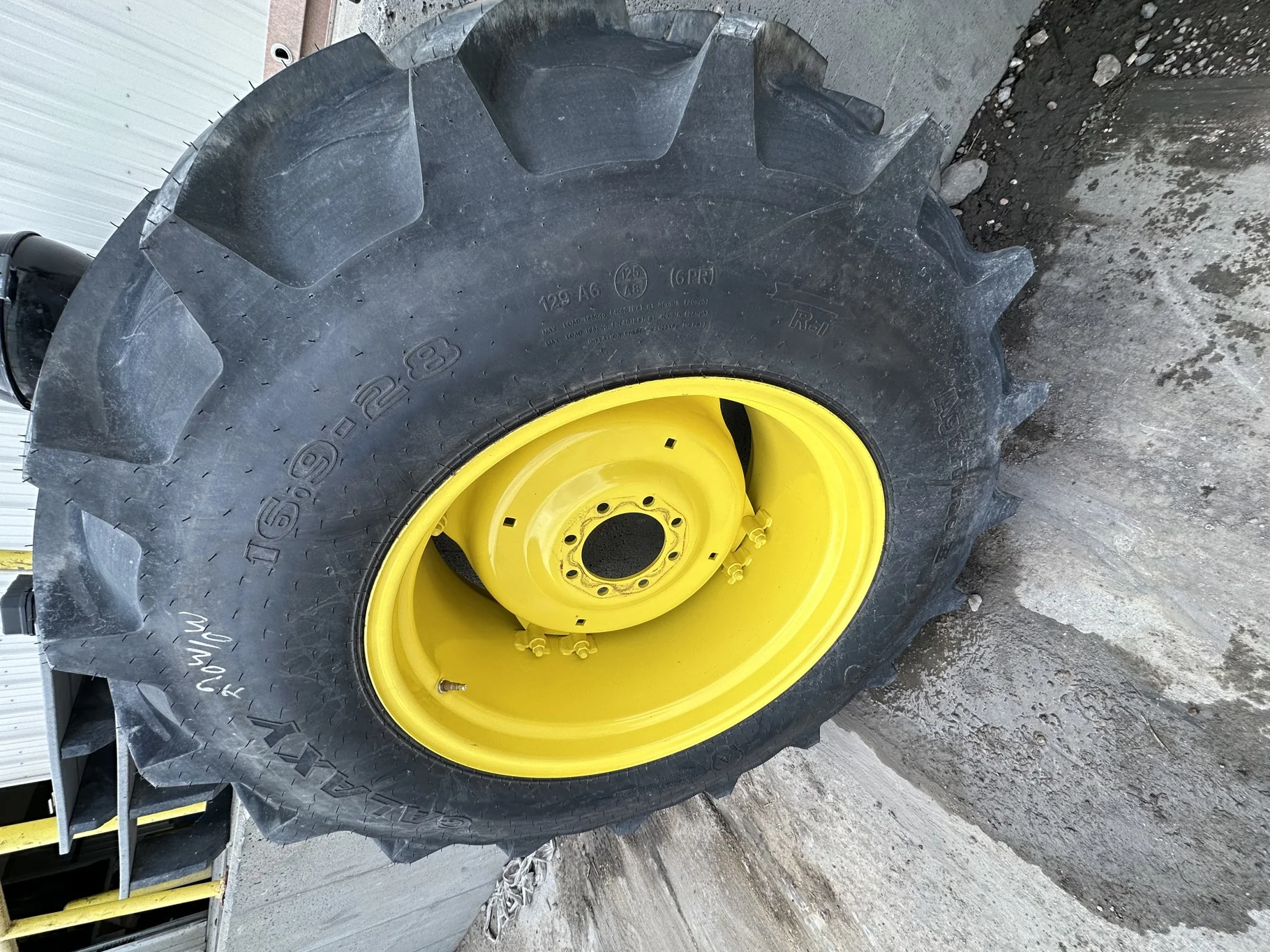 Take-Off 16.9-28 Galaxy Agritrac 2 R-1 D(6Ply) TL on a 15 X 28 JD GKN Wheel (2 Bolt) with a 28/30"