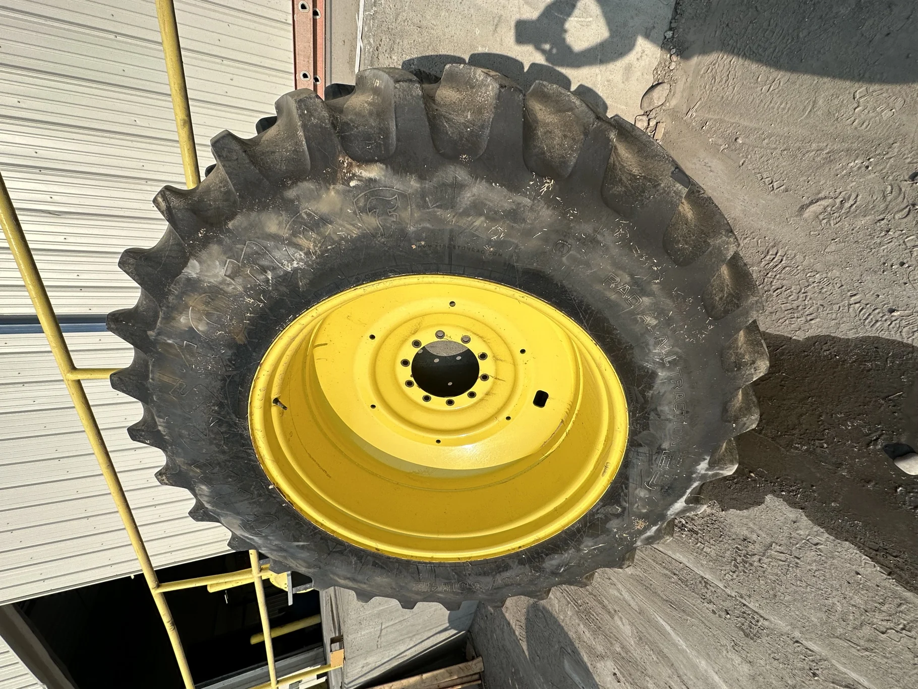 Used 520/85R42 Firestone Radial Deep Tread 23 R-1W 167B TL 80% on 18 x 42 John Deere Yellow 10 Bolt