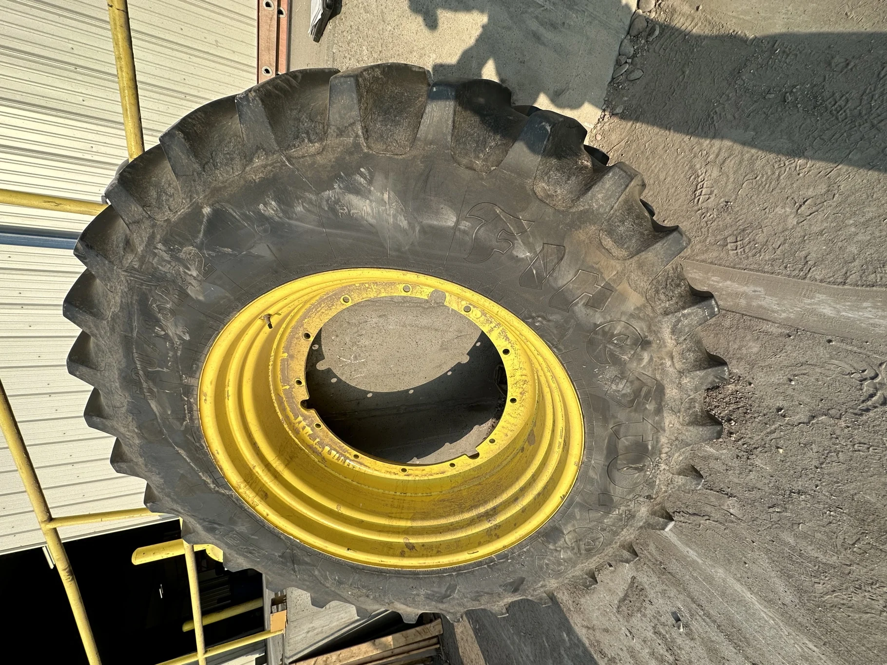 Used 520/85R42 Firestone Radial Deep Tread 23 R-1W 157B TL 85% on 18 x 42 JD Stub Disc - Fair Condi