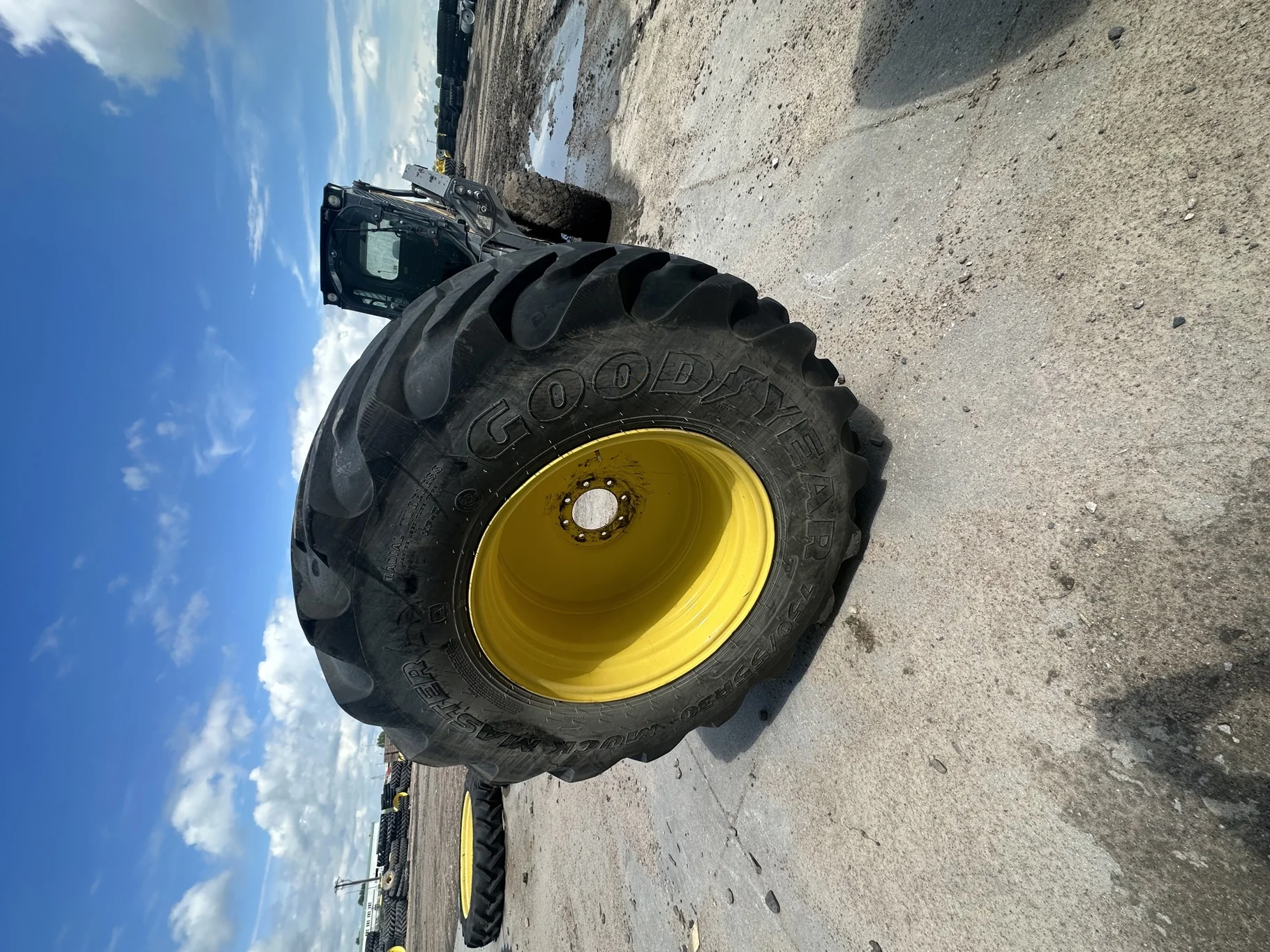 Used LSW 750/55R30 Goodyear Muck Master TL 85% on a 25 x 30 8-8-6 JD Yellow 8 Bolt Wheel