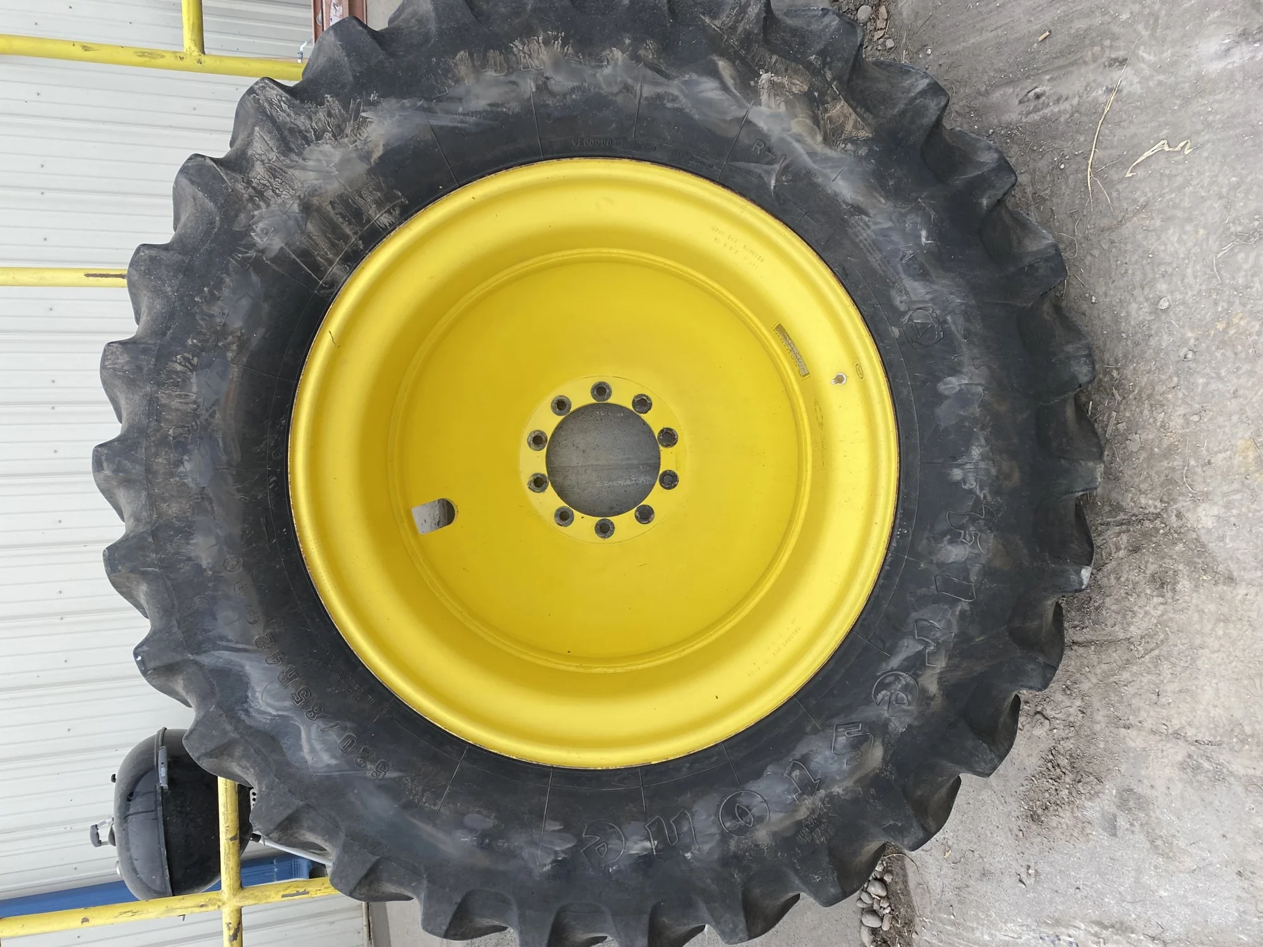 Used 520/85R42 Firestone Radial All Traction 23 R-1W 157B TL  75% on 18 x 42 JD Yellow 10 Bolt Dolly