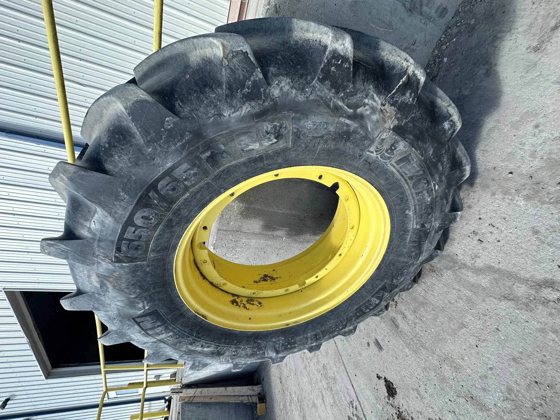 Used 650/65R38 Michelin MultiBib R-1W 157D TL 75% on a 18 x 38 JD Yellow 12 Bolt (.937) Stub D