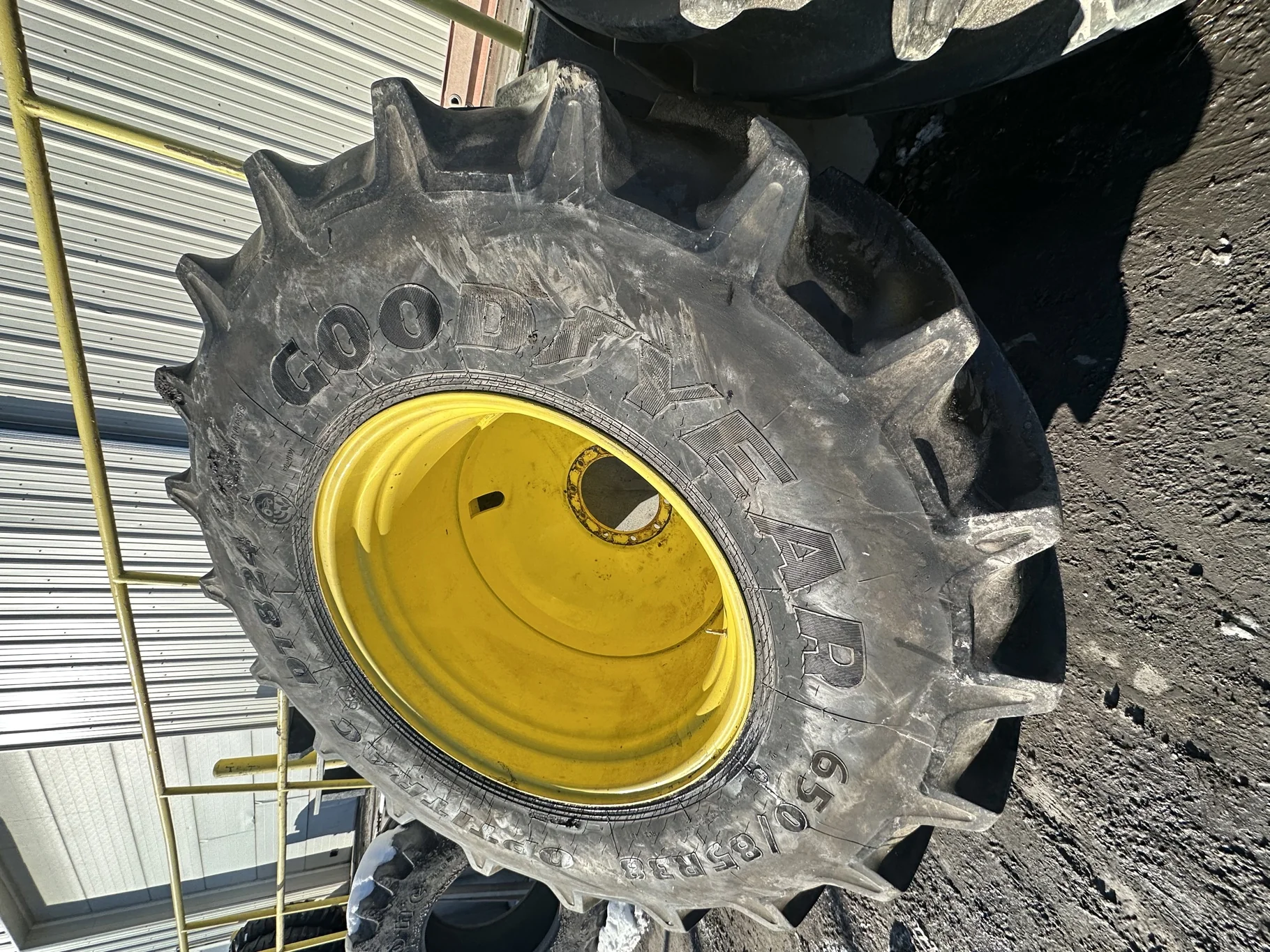 Used 650/85R38 Goodyear Optitrac 173D R-1W TL 90% on a 23 x 38 JD Yellow 10 Bolt Inside Dolly