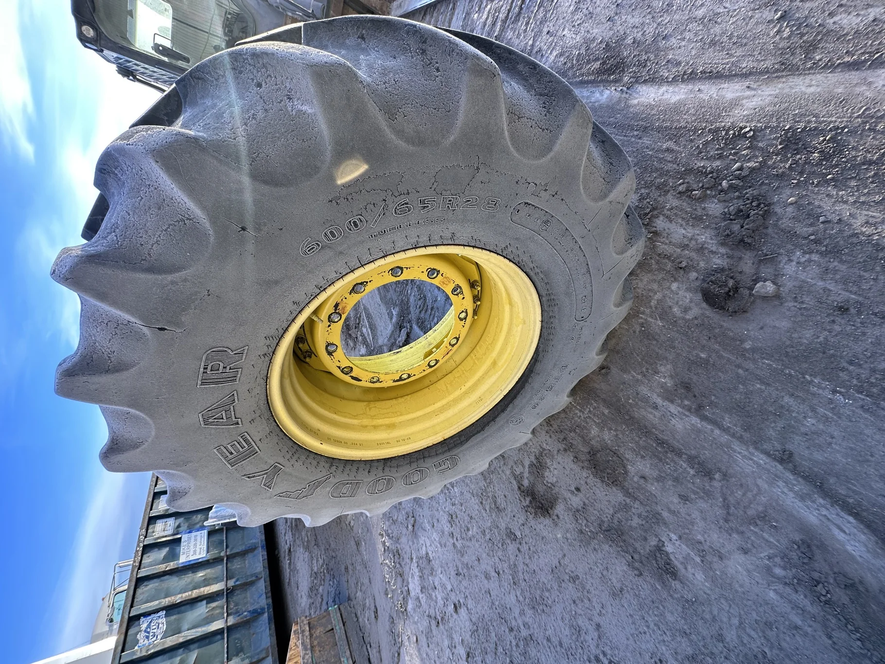 Used 600/65R28 Goodyear Optitrac (147B) R-1W TL 60% on a 18 X 28 JD Yellow Waffle 12-16.732 4" offse