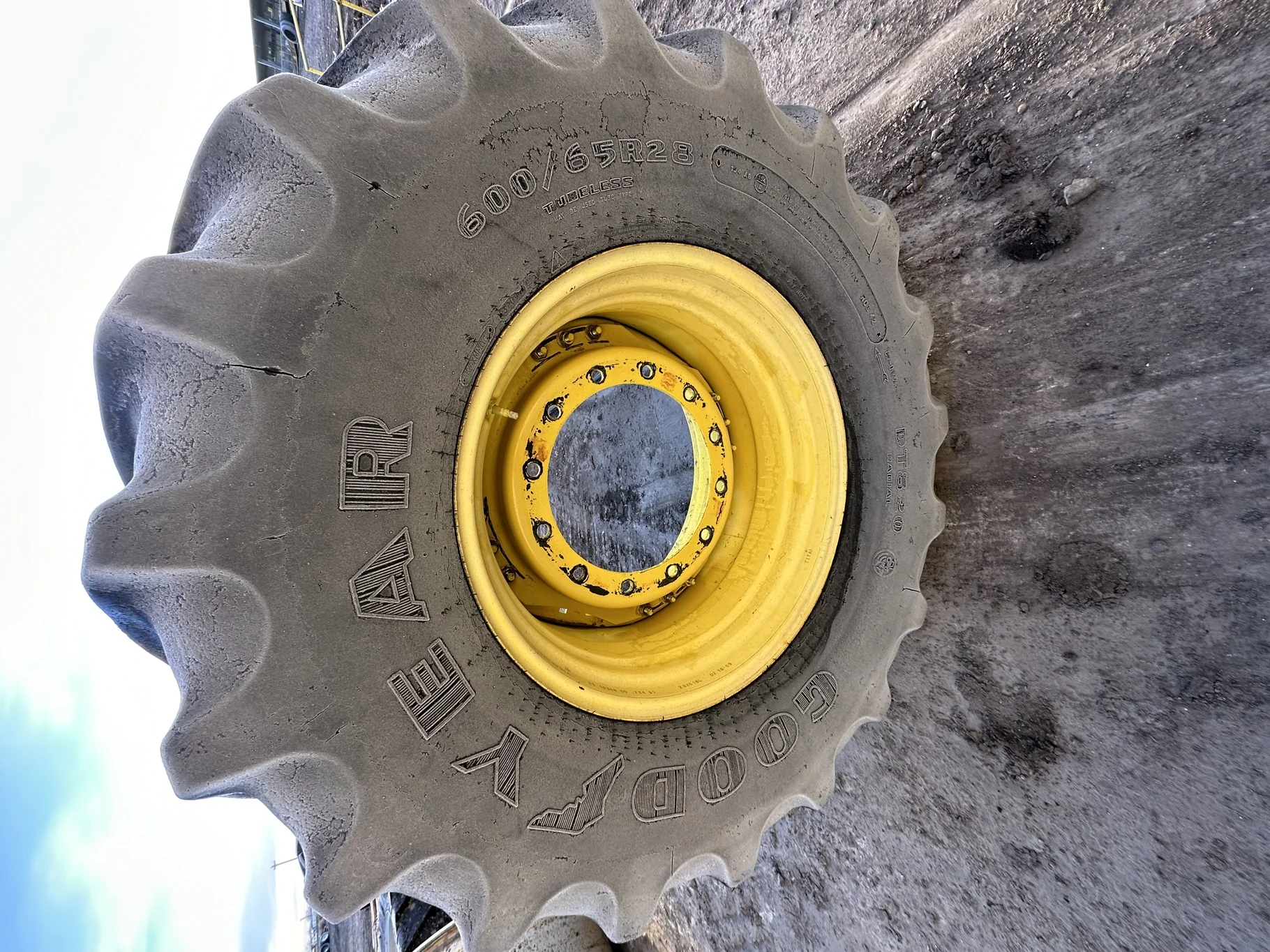 Used 600/65R28 Goodyear Optitrac (147B) R-1W TL 60% on a 18 X 28 JD Yellow Waffle 12-16.732 4" offse image 2