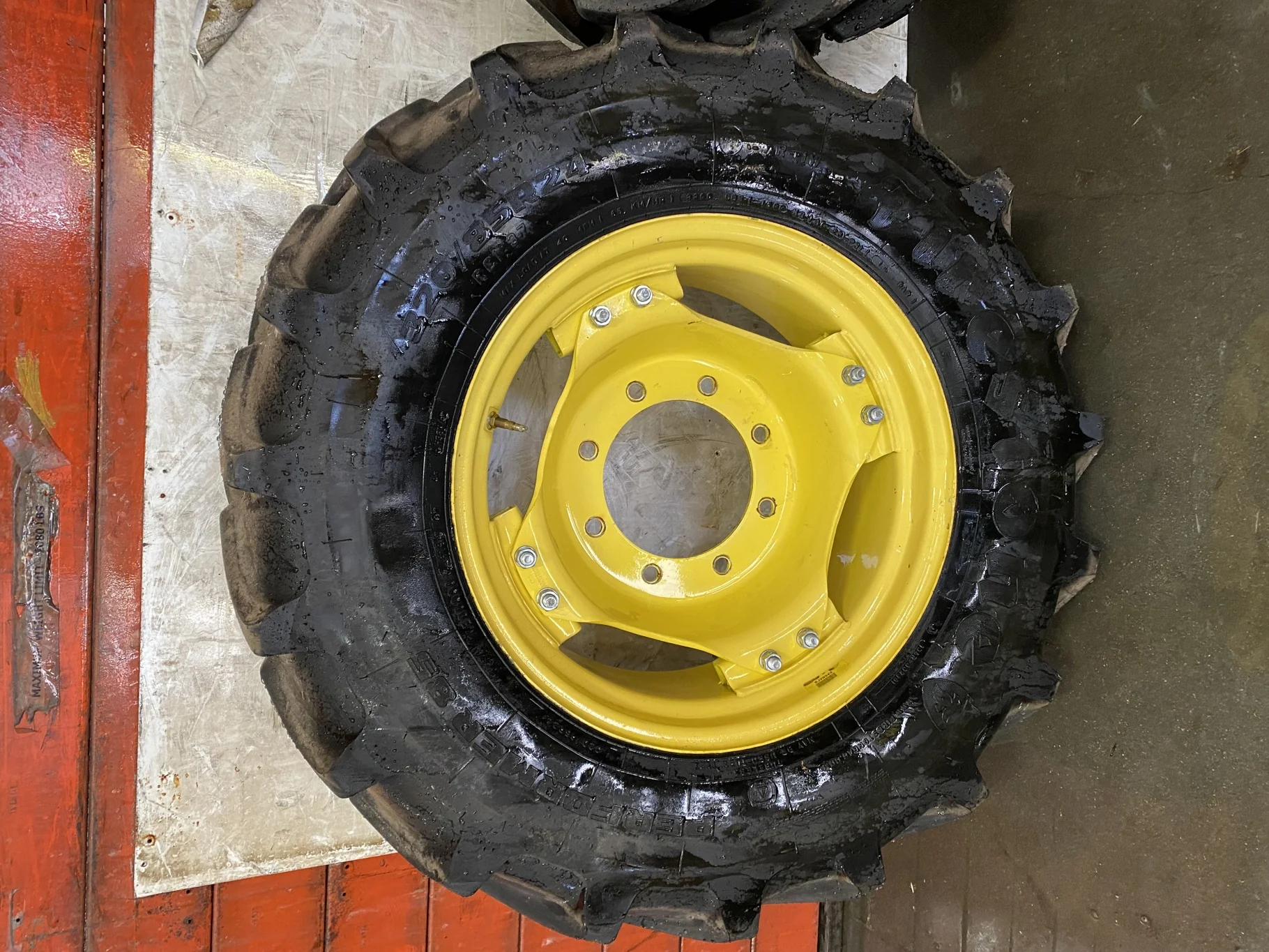 Used 85% 320/85R24 Firestone Performer 85 R1W 122D) on 10 x 24 JD Yellow 8-10.625-8.625 6 loop