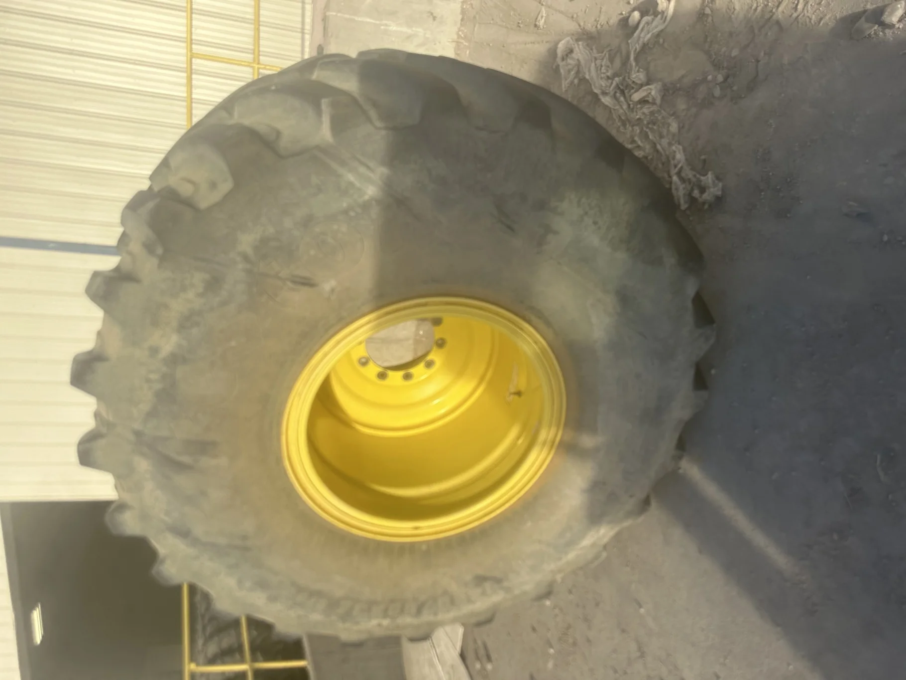 Used IF1250/50R32 CFO Firestone Radial Deep Tread 23 R-1W (201B) TL 90% on a 44 x 32 JD Yello