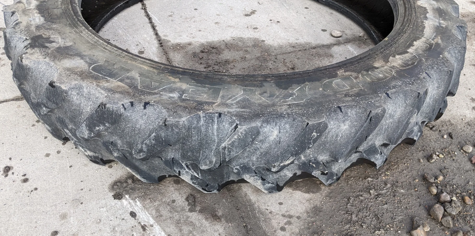 Used 320/80R42 Titan 49V R-1W (141B) TL 40% (uneven road wear, minor stubble forming on top of lugs) image 2