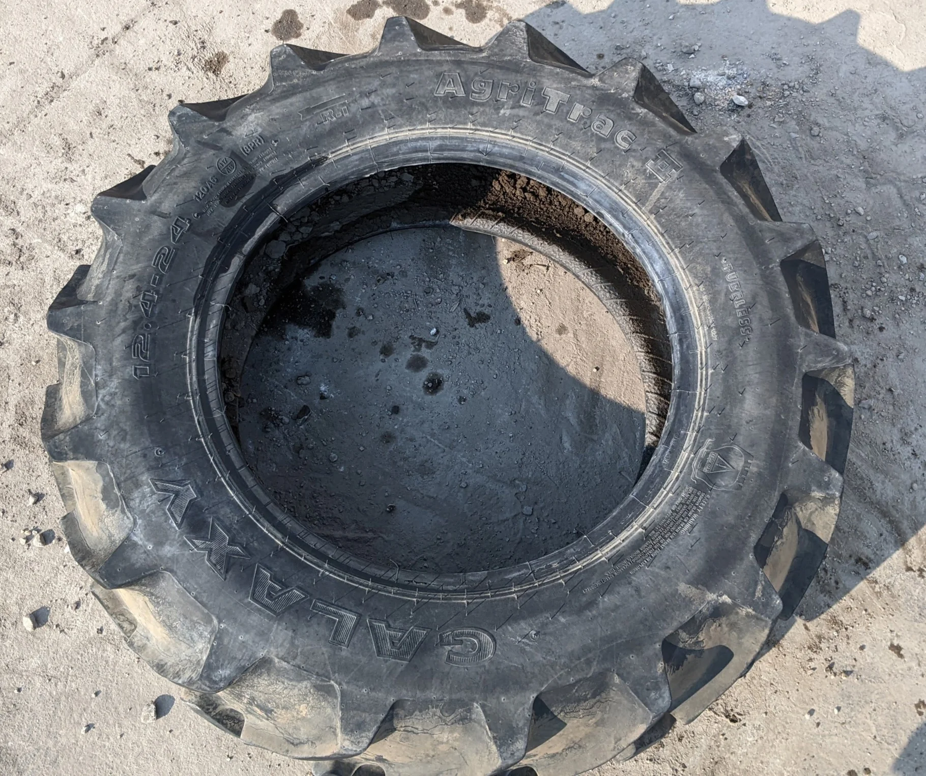 Used 12.4-24 Galaxy Agri Trac II R-1 D(8Ply) 75% uneven wear, road wear, cuts between lugs, lug cuts