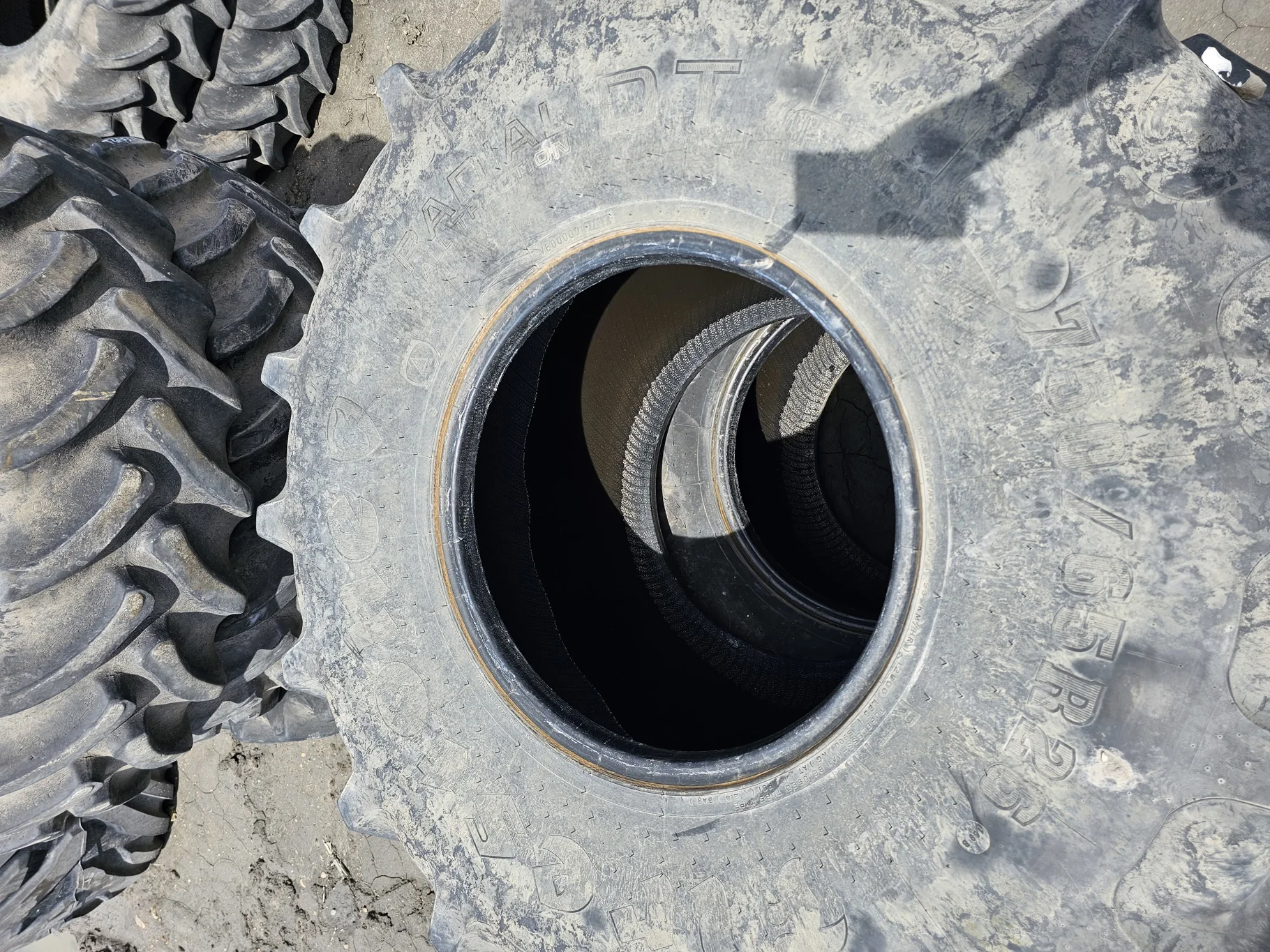 Used 70% 750/65R26 Firestone RAT DT R1W 169B (Stubble/Lug Cuts/Uneven Tread Wear)