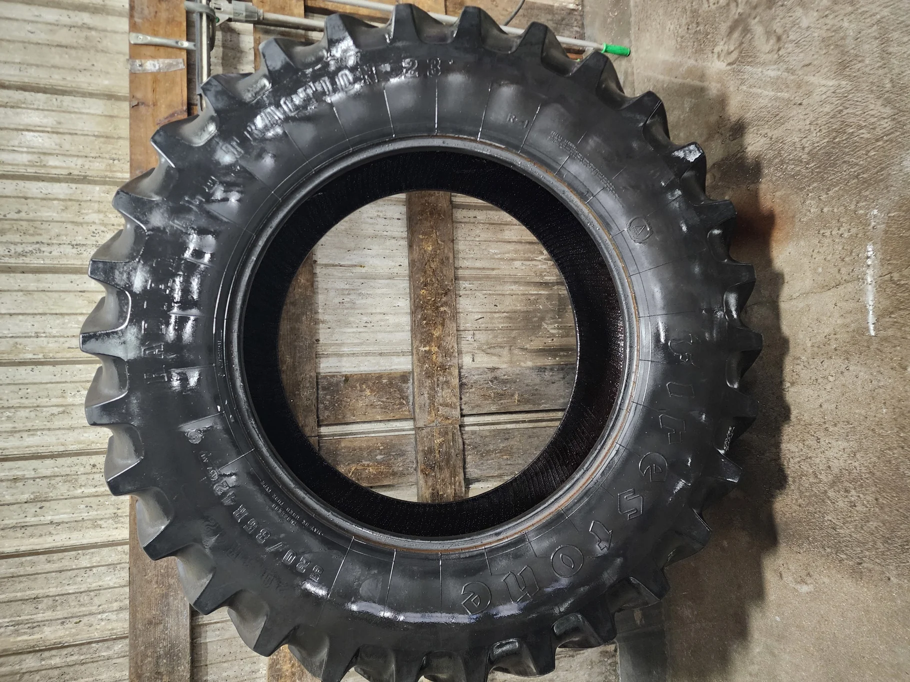 Used 520/85R42 Firestone Radial Deep Tread 23 R-1W (157B) TL 75%  (Lug Cuts, Stubble, Weathering, Sc
