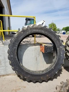 Used 320/105R54 Goodyear Super Traction Radial 60% - severe lug cuts