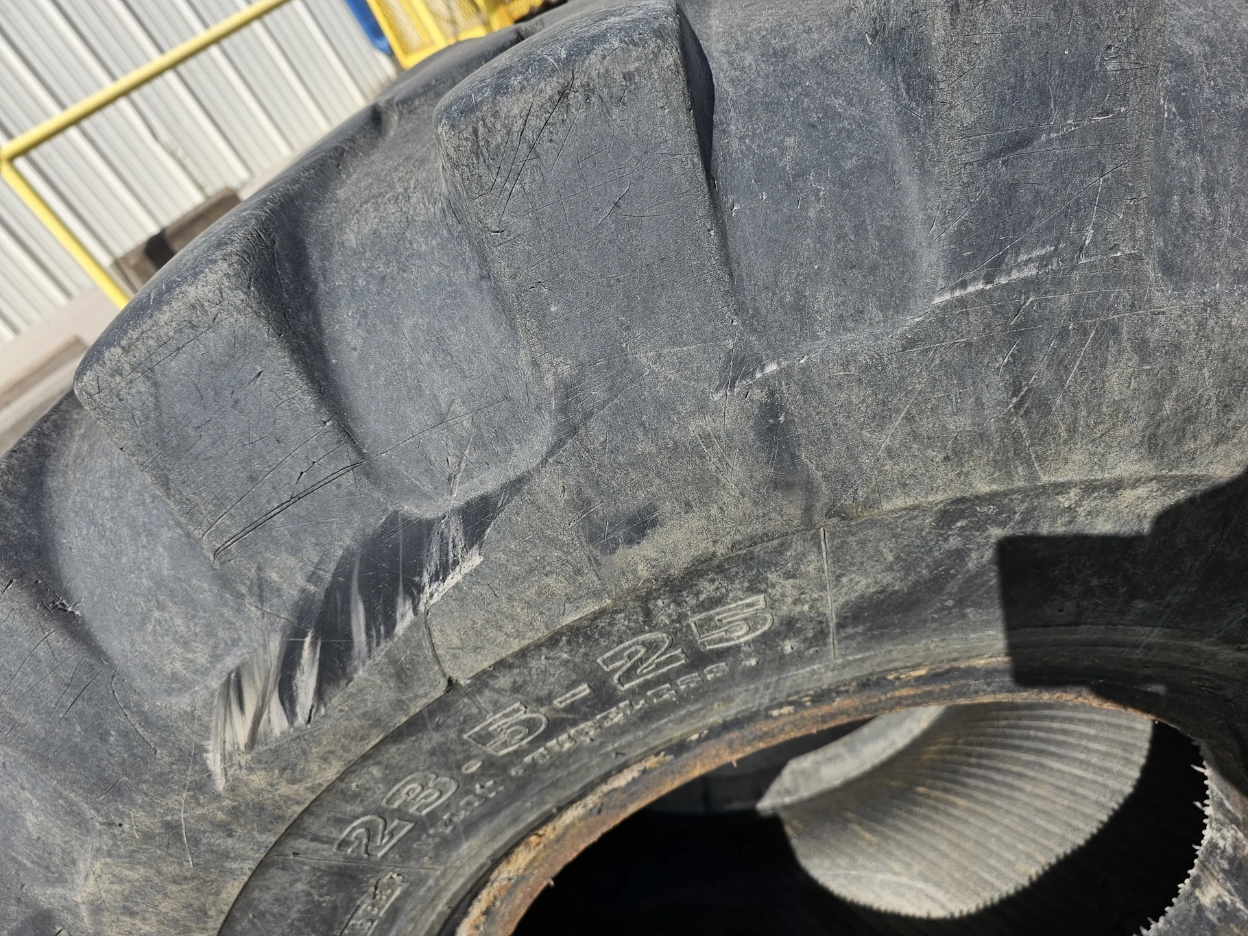 Used 23.5-25 Akuret E-2/L-2 16 ply 50% weathering, Stubble, Sidewall cuts, Lug Chunks missing, Lug c image 3