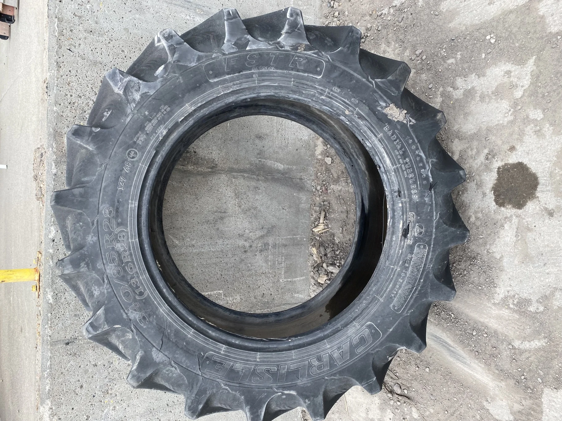 Used 340/85R28 Carlise FSTR 127A8 TL 70% (sidewall cuts, wreathing, road wear, lug cuts)