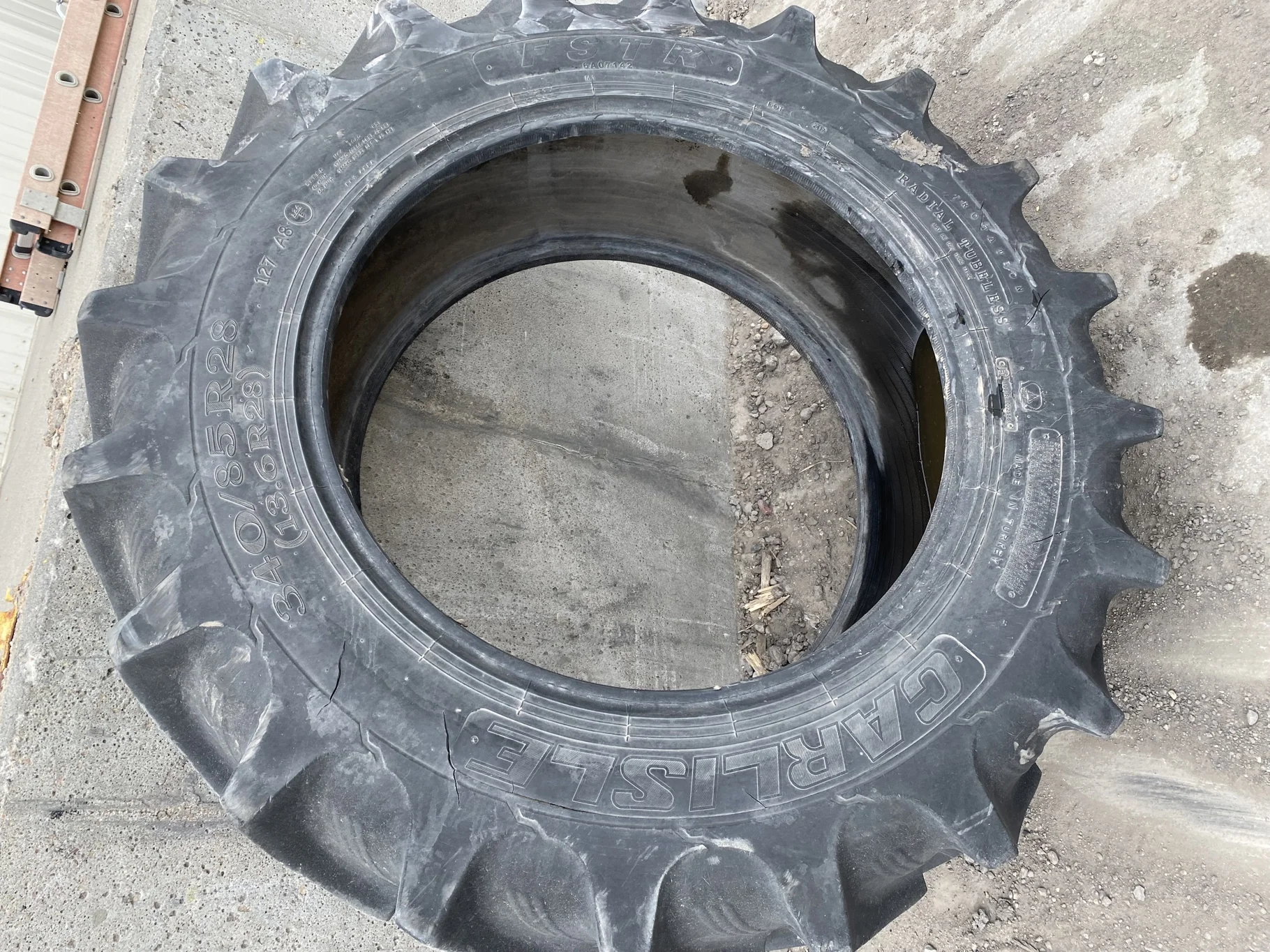 Used 340/85R28 Carlise FSTR 127A8 TL 70% (sidewall cuts, wreathing, road wear, lug cuts) image 2