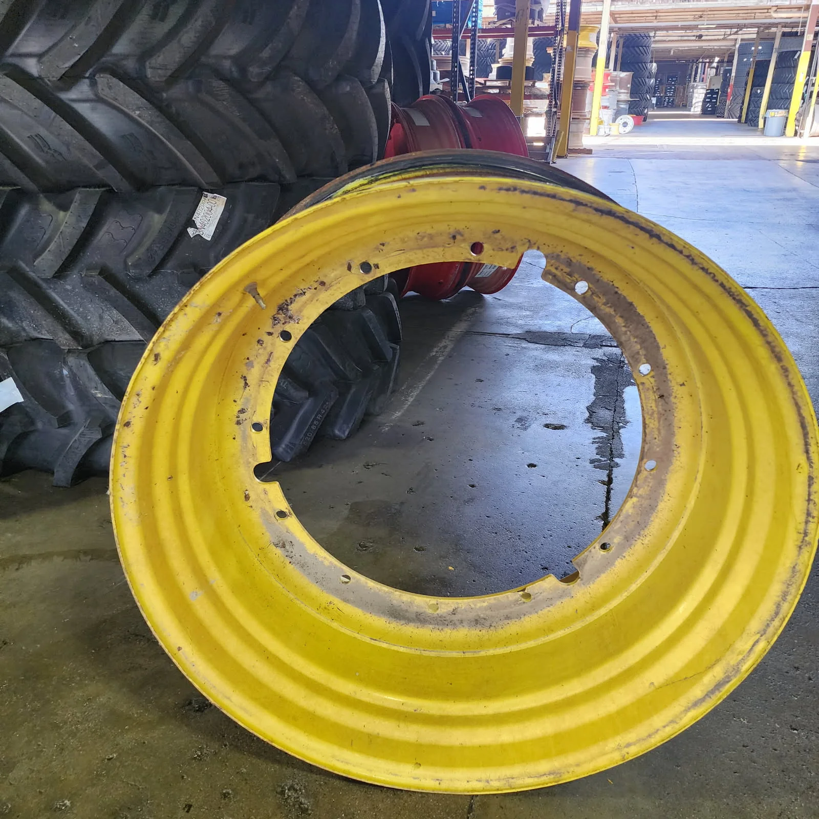 Used 20 X 42 12-32.047-30.078 7.2"BS Titan Yellow Rim & Rail Wheel