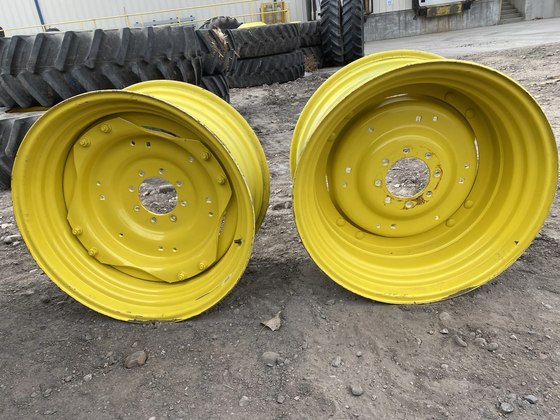 Used 15 X 30 John Deere Yellow Waffle Wheel (2 Bolt) (24-23.25) 9.5" BS with a 28/30" John Deere Yel